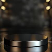 An empty black round table on a wooden surface photo
