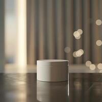 A white container sitting on a table in front of a window photo