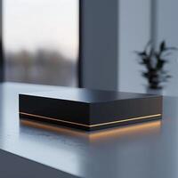 A black box sitting on a table in front of a window photo