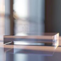A glass block sitting on a table in front of a window photo