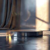 A round metal object on a floor in front of a window photo