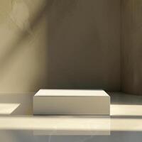 A white box sitting on a table in front of a wall photo