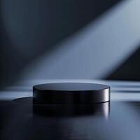 A black round table with a spotlight shining on it photo