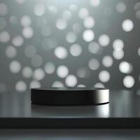 A black object on a table in front of a bright light photo