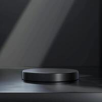 A black object on a table in front of a dark background photo