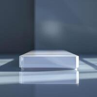 A white box sitting on a table in front of a window photo