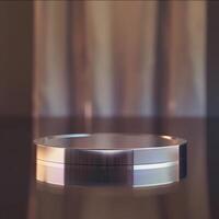 A silver circular object sitting on a table photo