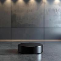 A black round object sitting on a concrete floor photo