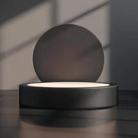 A black circular table with a circular light on it photo