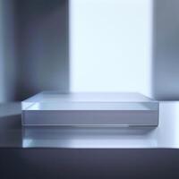 A glass box sitting on a table in front of a window photo