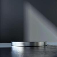 A silver round table on a dark floor photo