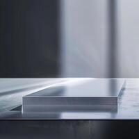 A metal sheet on a table in front of a window photo