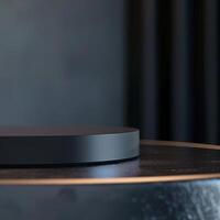 A black circular object on top of a table photo
