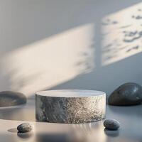 A stone table with a white marble top and some rocks photo