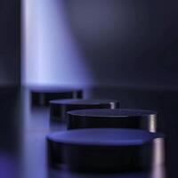 Three black round objects on a table photo