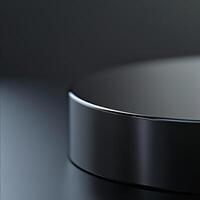 A black object on a table with a dark background photo