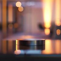 A black object sitting on a table in front of a blurry background photo