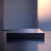 A black box sitting on a table in front of a window photo