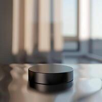 A black object sitting on a table in front of a window photo
