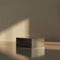 A square box sitting on a table in front of a wall photo