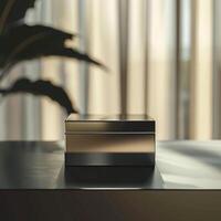 A black and gold box sitting on a table photo