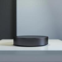 A black round object on a white surface photo