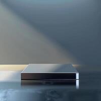 A silver box sitting on a table with a light shining on it photo