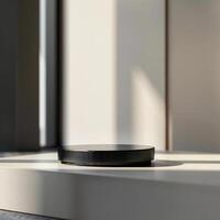 A black and white device sitting on a table photo