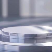 A white circular object on a table with a light photo