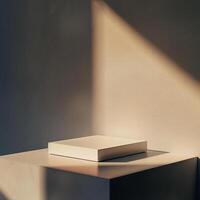 A white box sitting on a table in front of a wall photo