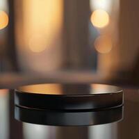A black object sitting on a table in front of a window photo