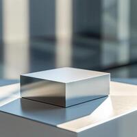 A silver cube sitting on top of a table photo