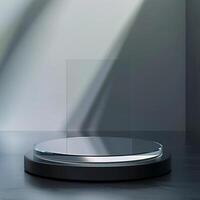 A glass display stand on a table in front of a wall photo