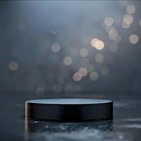 An empty hockey puck on a table in front of a blurry background photo