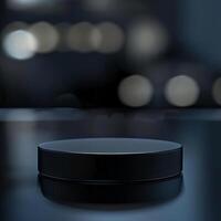 A black object sitting on a table in front of a blurred background photo