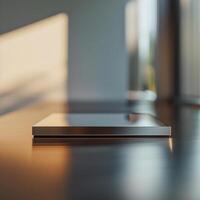 A laptop sitting on a table in front of a window photo