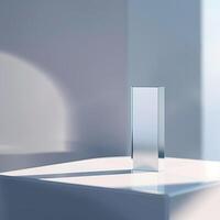A square object sitting on a table in front of a white wall photo
