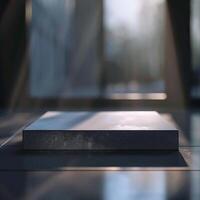 A white box sitting on a table in front of a window photo