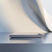 A white box sitting on a table in front of a wall photo