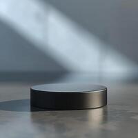 A black object sitting on a table in front of a wall photo