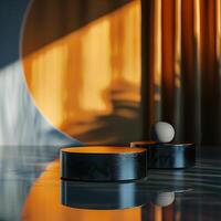 Two black boxes sitting on a table with a light shining on them photo