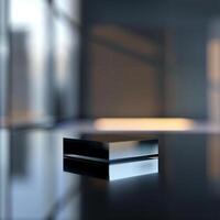 A black box sitting on a table in front of a window photo
