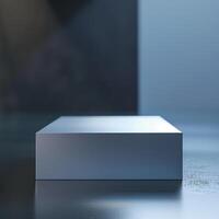 A white box sitting on a table in front of a wall photo
