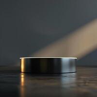 A black circular table with a light shining on it photo