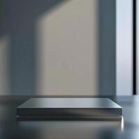An empty metal box sitting on a table in front of a window photo