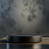A black round table on a table with a wall behind it photo