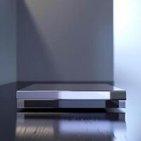 A silver box sitting on a table in front of a window photo