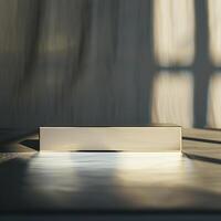 A white box sitting on a table in front of a window photo