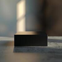A black box sitting on a table in front of a window photo