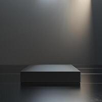 An empty black box on a dark floor with a spotlight photo